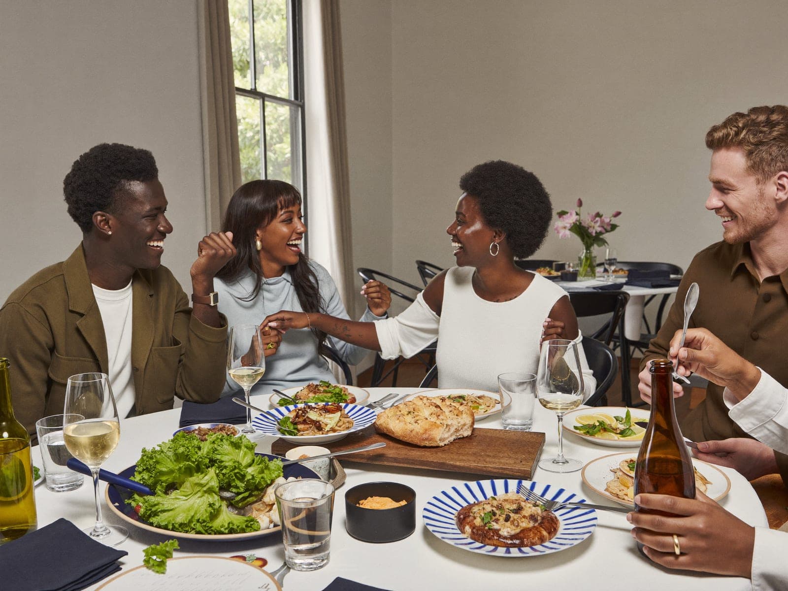 Diners sharing a meal at a restaurant table